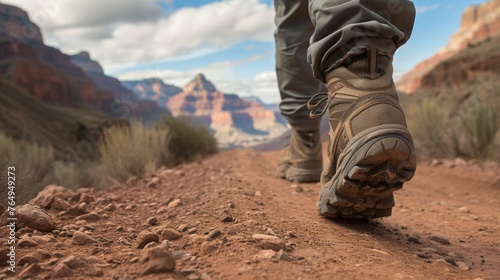 Closeup view of a hiker hiking in rugged land with majestic view.