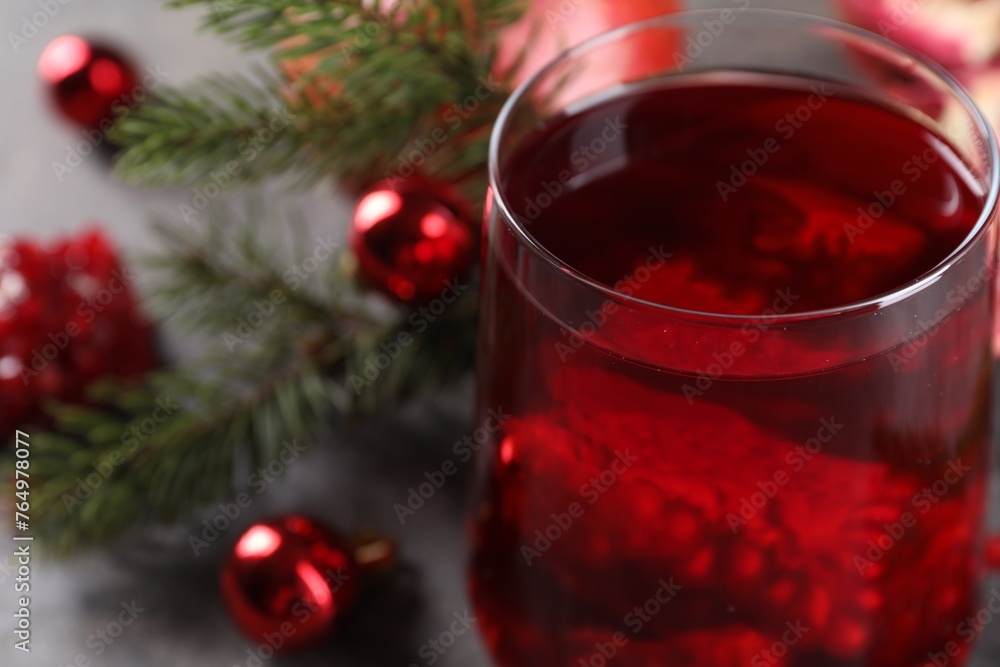 Aromatic Christmas Sangria drink in glass on table, closeup. Space for text Aromatic Christmas Sangria drink in glass on table, closeup. Space for text