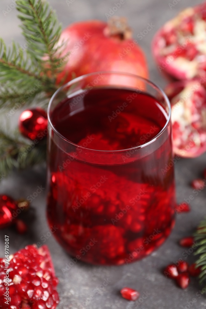 Aromatic Sangria cocktail in glass on grey table, closeup. Christmas drink Aromatic Sangria cocktail in glass on grey table, closeup. Christmas drink