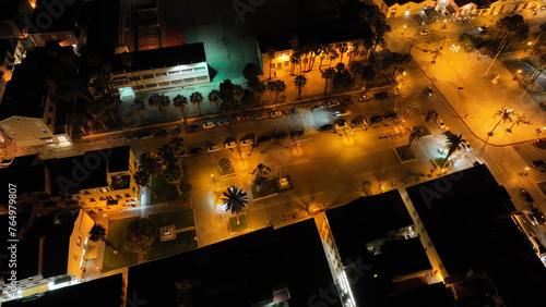 Aerial drone night shot of illuminated historic old city of Nafplio former capital of Greece, Argolida, Peloponnese