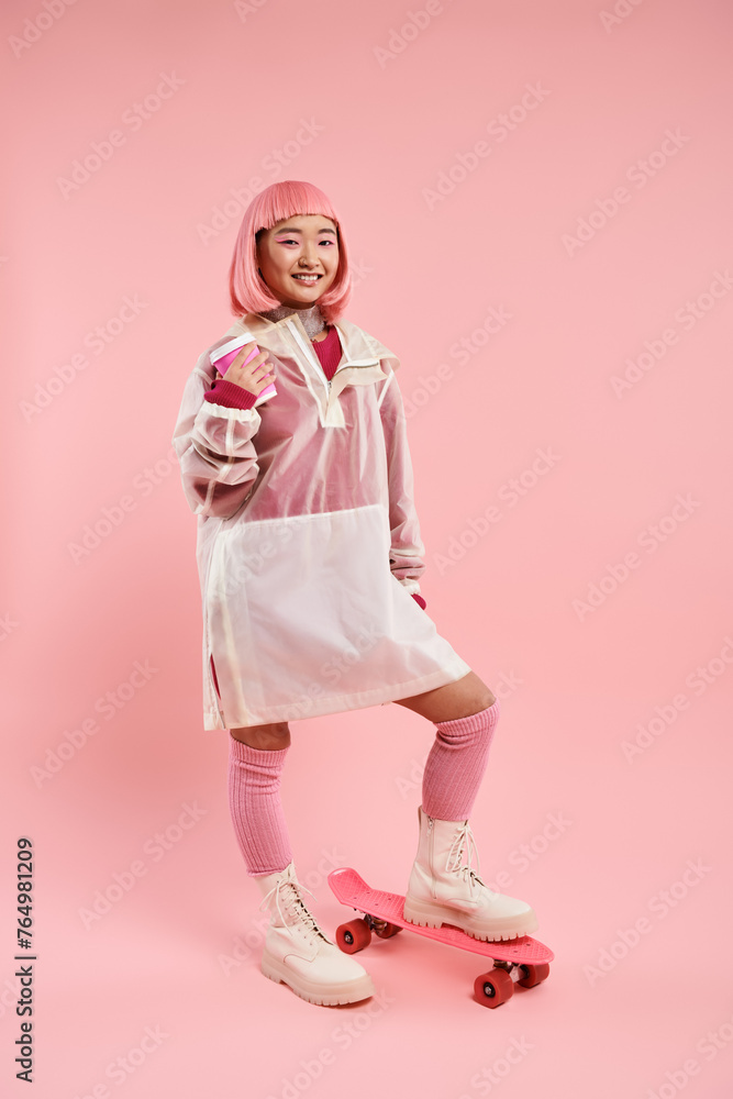 happy woman in pink stylish outfit posing with cup of coffee and skateboard on vibrant background happy woman in pink stylish outfit posing with cup of coffee and skateboard on vibrant background