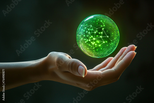 An outstretched hand presenting a spherical object with a green glowing network pattern  symbolizing futuristic technology.
