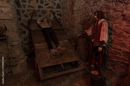 Executioner and victim figurine in the dungeon of the torture chamber.