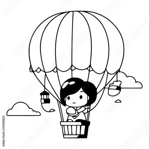 Cute little girl flying in hot air balloon. photo