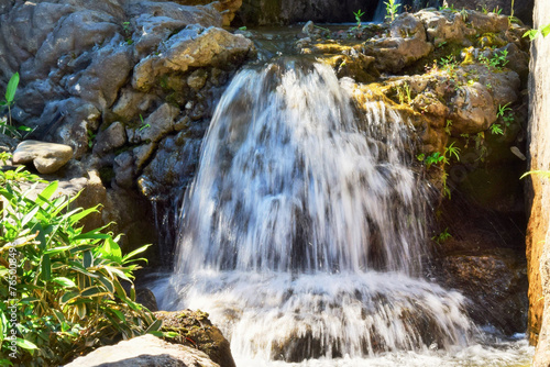 Natural background. Jets of a mountain waterfall