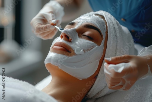 Cosmetologist at spa salon applying sheet mask on face of relaxed woman. Young girl lying on white towel and enjoying peeling and antioxidant facial beauty treatment. Skin care, Generative AI 