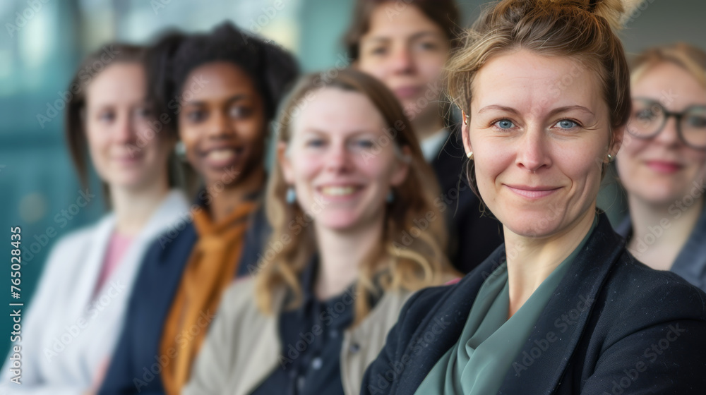 A group of women are smiling for a photo A group of women are smiling for a photo
