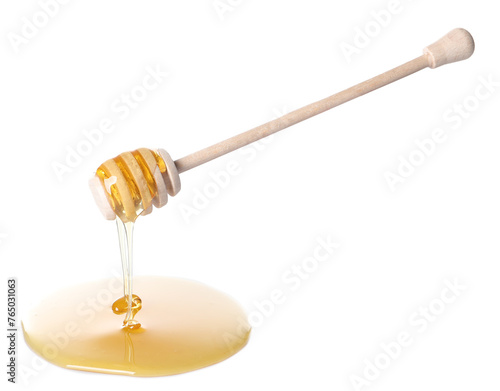 Fresh honey dripping from dipper on white background