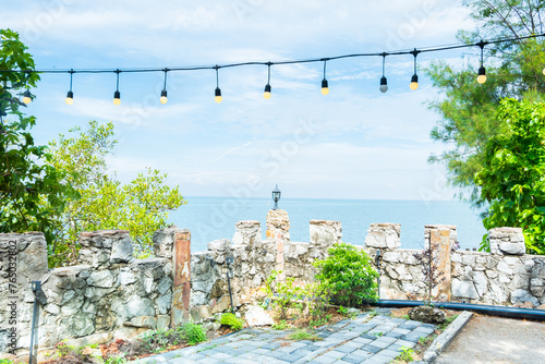 Fototapeta Naklejka Na Ścianę i Meble -  View of the Sea and the lamp on the pole,Summer blue beach and travel vacation.