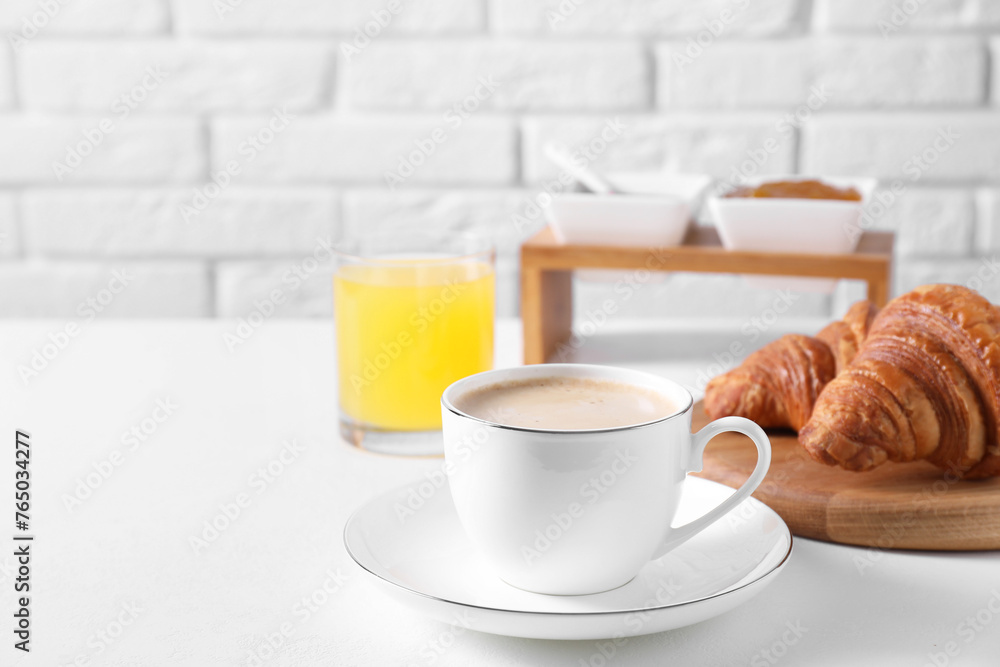 Breakfast time. Fresh croissants and coffee on white table. Space for text - obrazy, fototapety, plakaty 