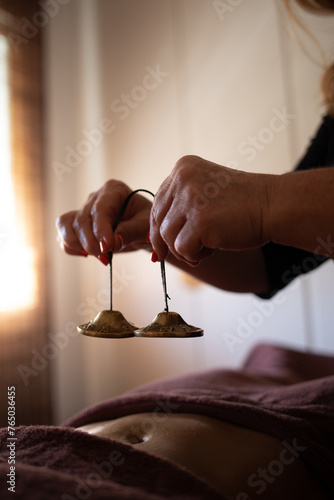 Therapist crashes on a woman's body cymbals bells