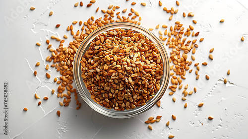Top view sesame seeds in a glass bowl on a white background (ID: 765038492)