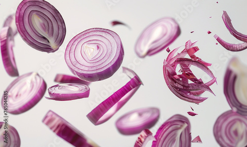 sliced red onions floating in the air on the white background.