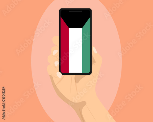 Kuwait flag on mobile phone screen, holding smartphone, advertising social media or banner concept