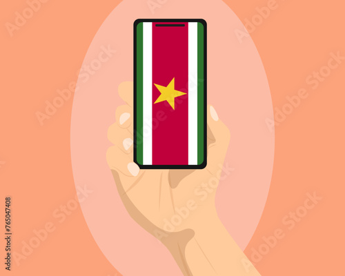 Suriname flag on mobile phone screen, holding smartphone, advertising social media or banner concept