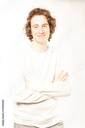 young photographer smiles while captured in high key lighting