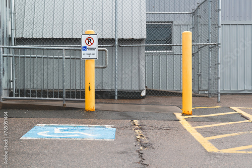 Disabled or handicapped parking space in front of industrial building