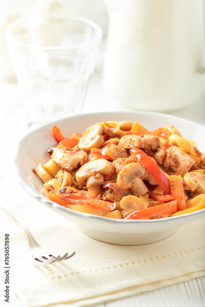 Pappardelle Pasta with chicken breast, red pepper and champignons. Bright background. Close up. Pappardelle Pasta with chicken breast, red pepper and champignons. Bright background. Close up.