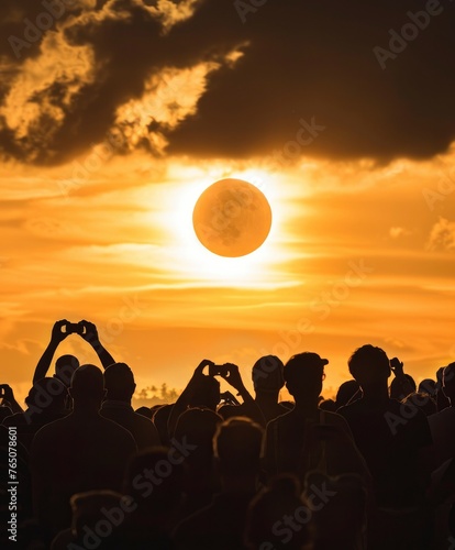 A crowd of people watching the solar eclipse wearing protective glasses