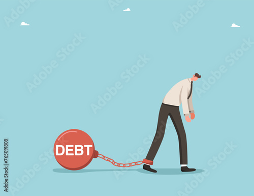 Financial difficulties, debt or credit obligations, payment of interest payments on bank loans, investment risks, borrowing and loss money, business failure, man chained with prison shackles to debt.