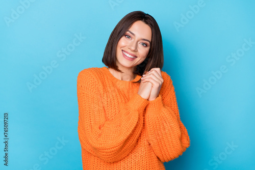 Portrait of attractive cheerful pleased girl waiting hope appreciate isolated over bright blue color background © deagreez