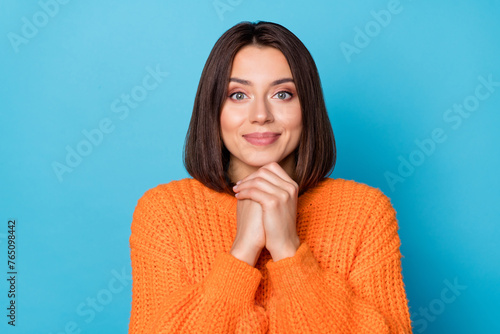 Portrait of attractive pleased cheerful girl enjoying good mood isolated over bright blue color background