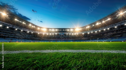 Illuminated stadium with lush green grass - An empty sports stadium brightly lit showcasing the expansive green playing field and seating areas