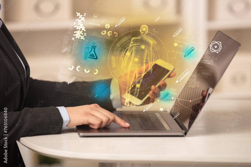 Doctor working on laptop with healthcare concept Doctor working on laptop with healthcare concept