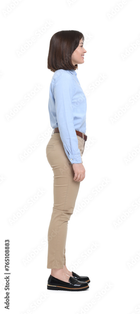 Happy businesswoman in blue shirt and beige pants on white background Happy businesswoman in blue shirt and beige pants on white background