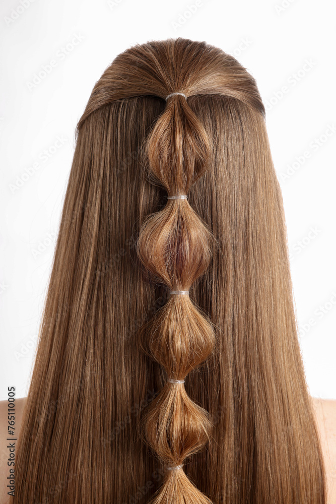 Woman with braided hair on white background, back view Woman with braided hair on white background, back view