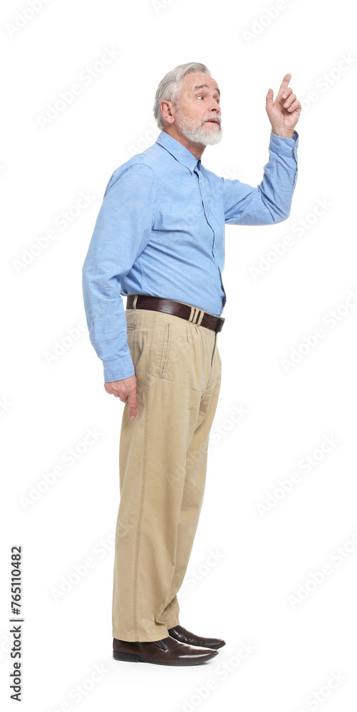 Senior man pointing at something on white background Senior man pointing at something on white background