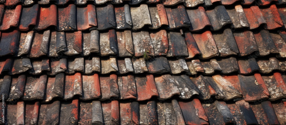 Close-up view of a residential house with a traditional roof made of red tiles, under a clear blue sky Close-up view of a residential house with a traditional roof made of red tiles, under a clear blue sky