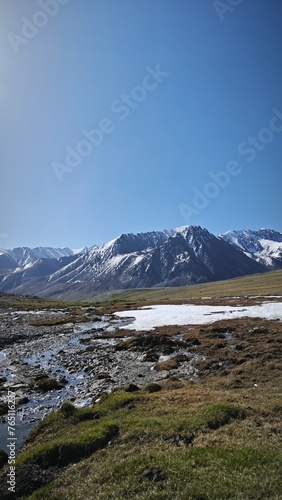 landscape with lake and snowy mountains