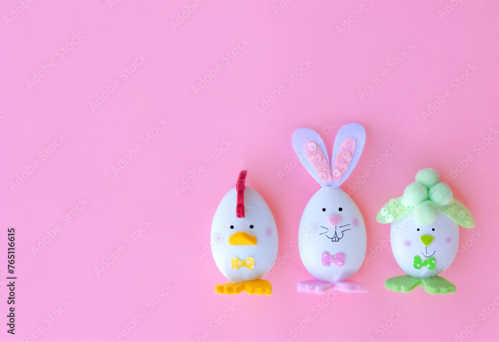 funny greeting poster or postcard with happy easter, three decorated easter eggs on a background with space for text funny greeting poster or postcard with happy easter, three decorated easter eggs on a background with space for text
