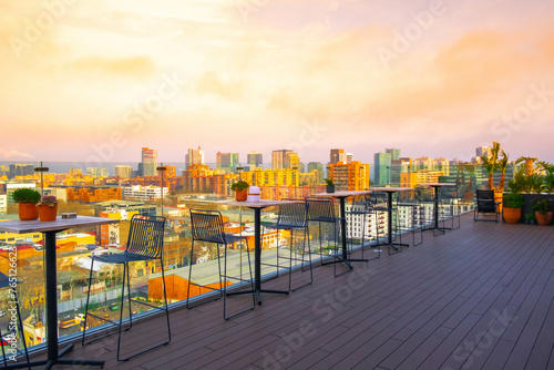 Photography Luxury terrace view in the Barcelona district of Poblenou with the city skyline at sunset