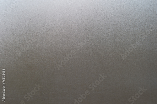 Water drops on fogged glass with a gray brightness gradient. Background