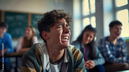 Teenage student crying among classmate laughing at them . Problems in teenagers at school . photo