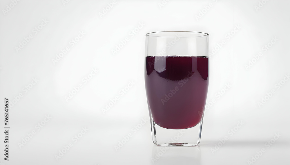 glass of grape juice on a white background glass of grape juice on a white background
