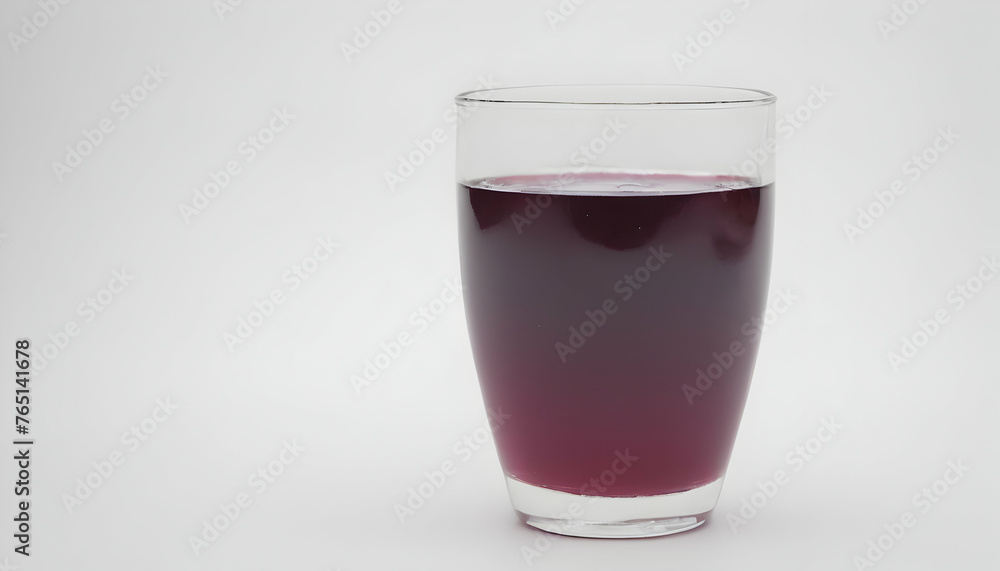 glass of grape juice on a white background glass of grape juice on a white background