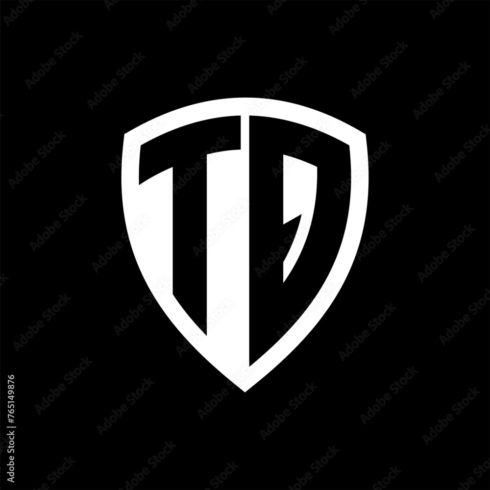 TQ monogram logo with bold letters shield shape with black and white color design TQ monogram logo with bold letters shield shape with black and white color design