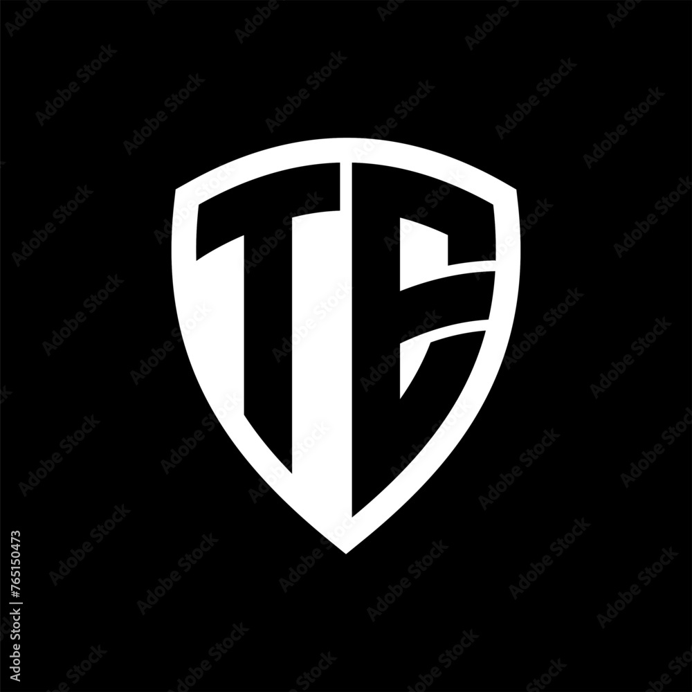 TE monogram logo with bold letters shield shape with black and white ...