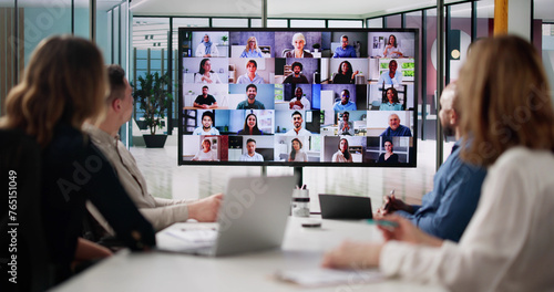 Group Of Businesspeople Having Video Conference photo