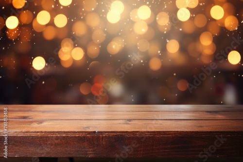 A wooden table with blurred lights in the background