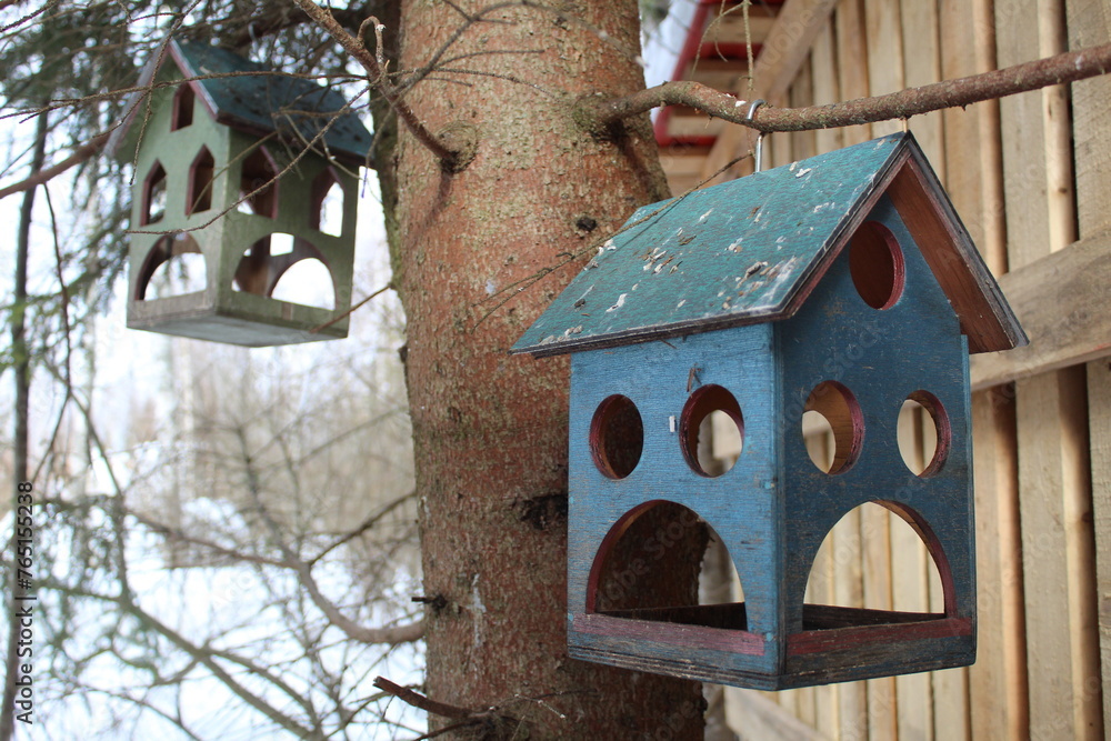 bird feeder in the form of a blue house bird feeder in the form of a blue house