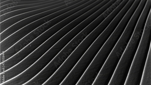 a black and white photo of a pleated piece of cloth on a table cloth that looks like a pleated piece of cloth. photo