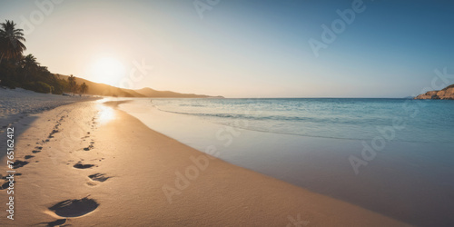 Paradisiacal beach on a summer day. Sea, mountains, sand and blue sky. Environment concept. Space for text.