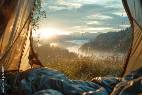 A person relaxing in a tent as the sun sets. Suitable for outdoor and camping themes