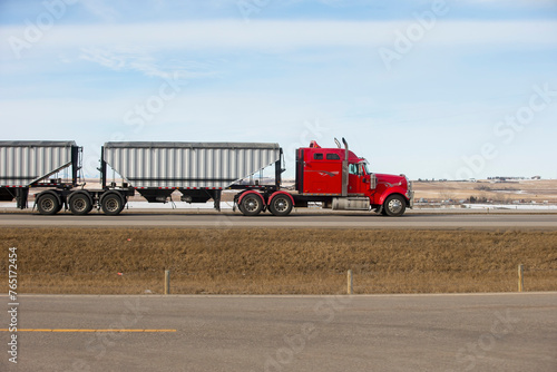 Heavy Cargo on the Road. A truck hauling freight along a highway. Taken in Alberta, Canada