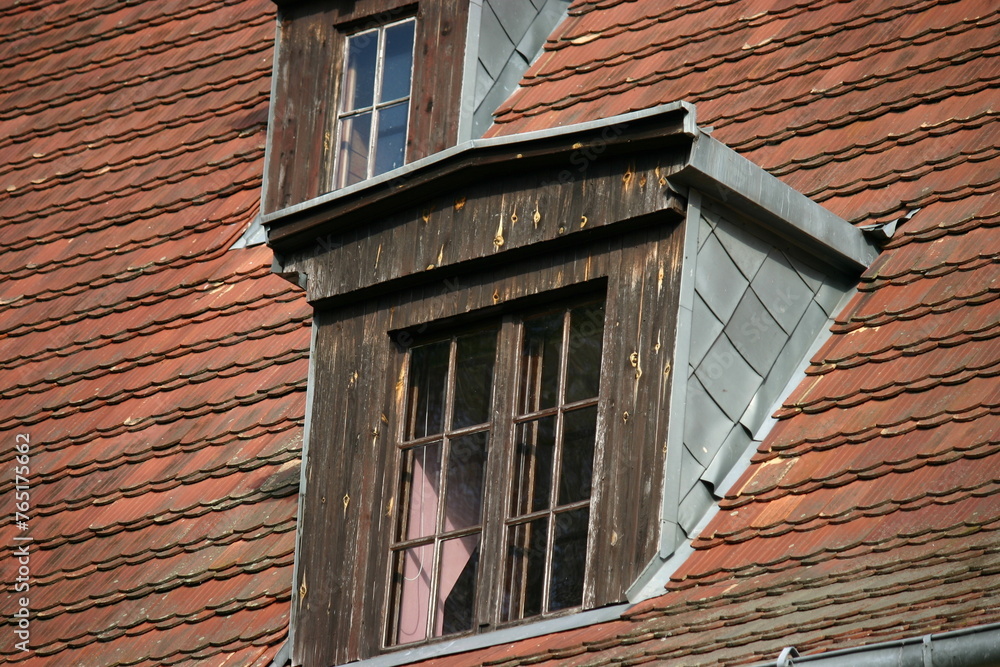 Fototapeta premium Old house with red tiles and dormers