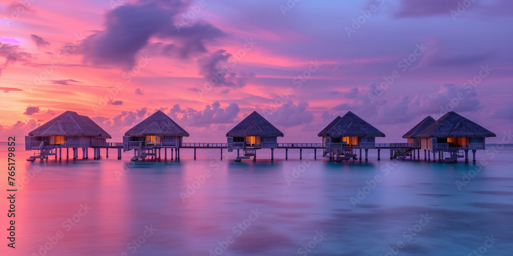 Fototapeta premium Serene Sunrise Over Tropical Overwater Villas